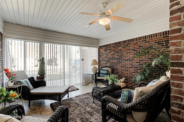 sunroom with a ceiling fan