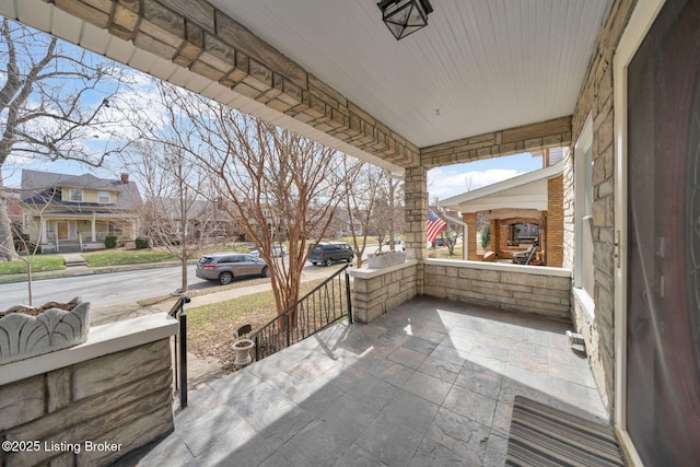 view of patio with a residential view and covered porch