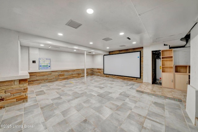 cinema room featuring recessed lighting, visible vents, and wainscoting