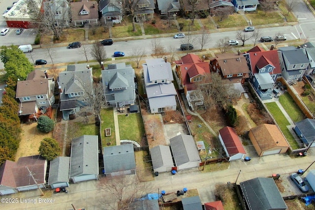 birds eye view of property with a residential view