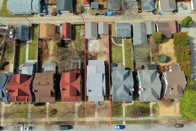 birds eye view of property with a residential view