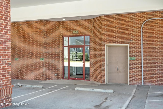 view of exterior entry featuring a garage