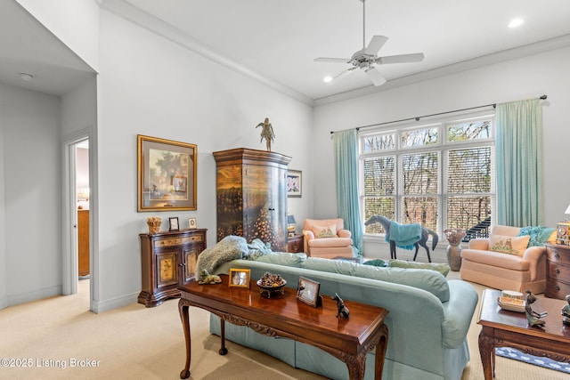 living area with baseboards, light colored carpet, ornamental molding, recessed lighting, and a ceiling fan