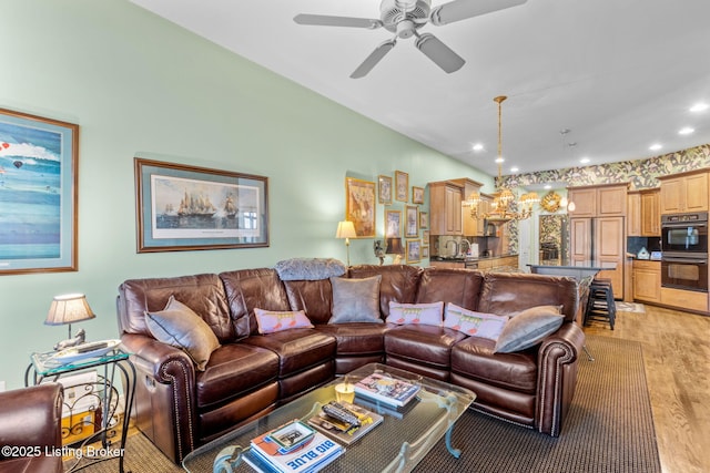 living area with recessed lighting, light wood-style flooring, and ceiling fan