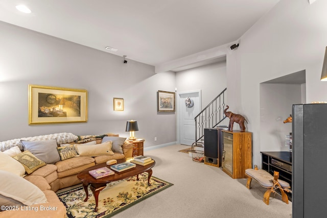 carpeted living area featuring visible vents, recessed lighting, stairs, and baseboards