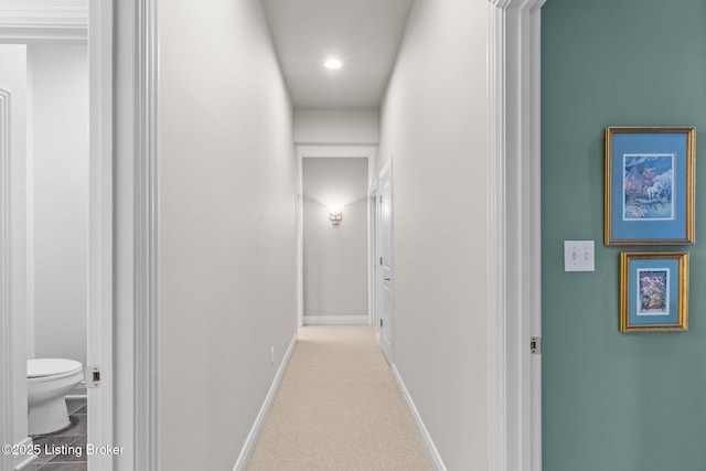 hallway with carpet flooring, recessed lighting, and baseboards