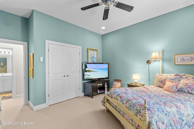 carpeted bedroom with baseboards, a closet, and ceiling fan