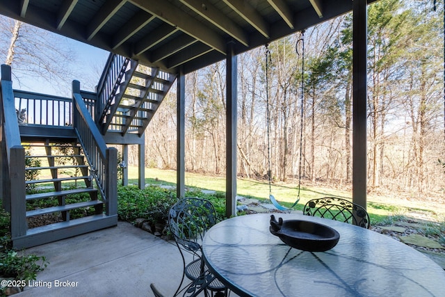 view of patio / terrace featuring stairway and outdoor dining area