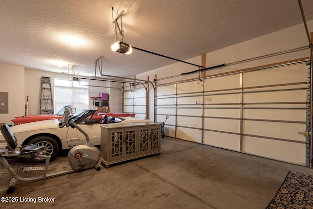 garage featuring electric panel and a garage door opener