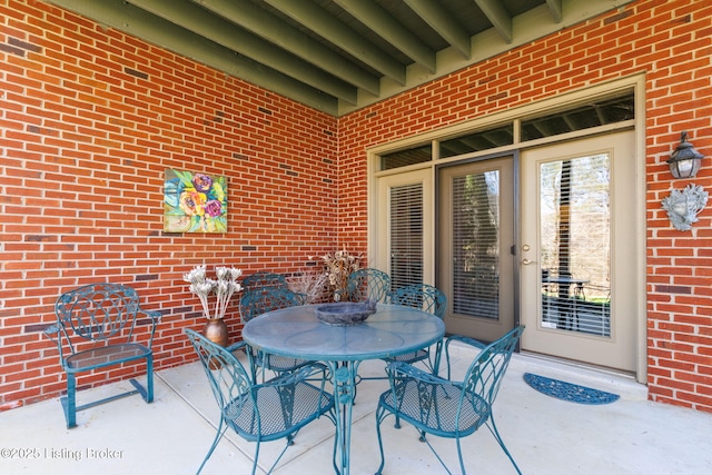 view of patio featuring outdoor dining area