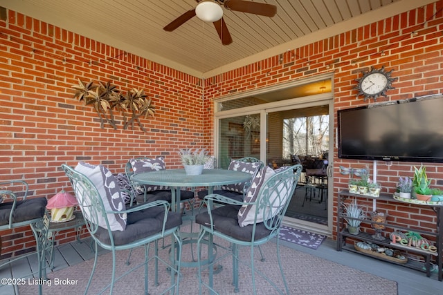 view of patio featuring outdoor dining space and ceiling fan