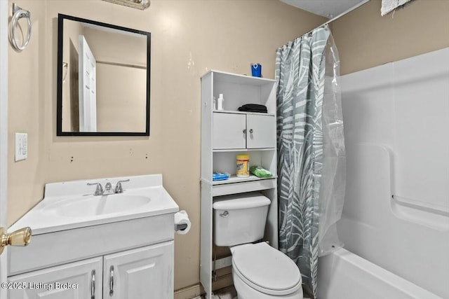 bathroom featuring toilet, shower / bath combination with curtain, and vanity