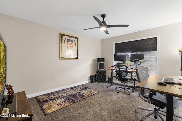 office area with carpet flooring, a ceiling fan, and baseboards