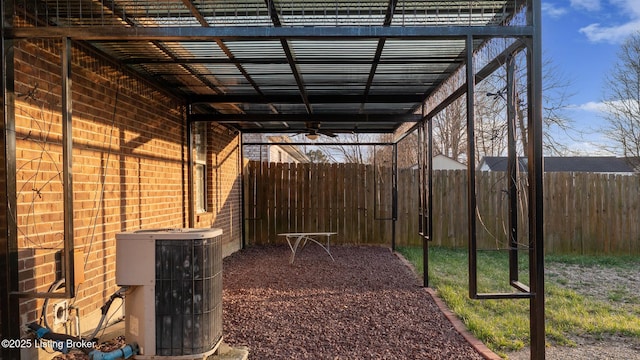 view of yard with cooling unit and fence