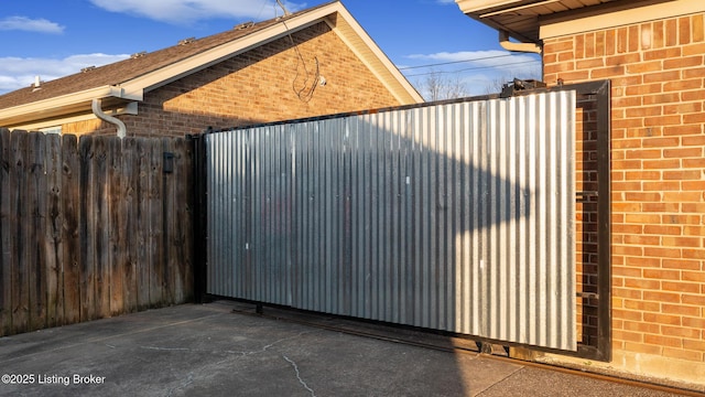 view of gate with fence