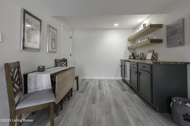 interior space with recessed lighting, baseboards, and light wood-style flooring