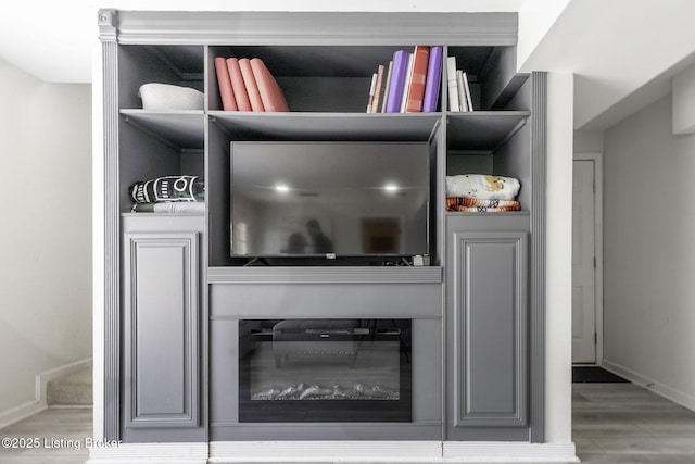 room details with baseboards and wood finished floors