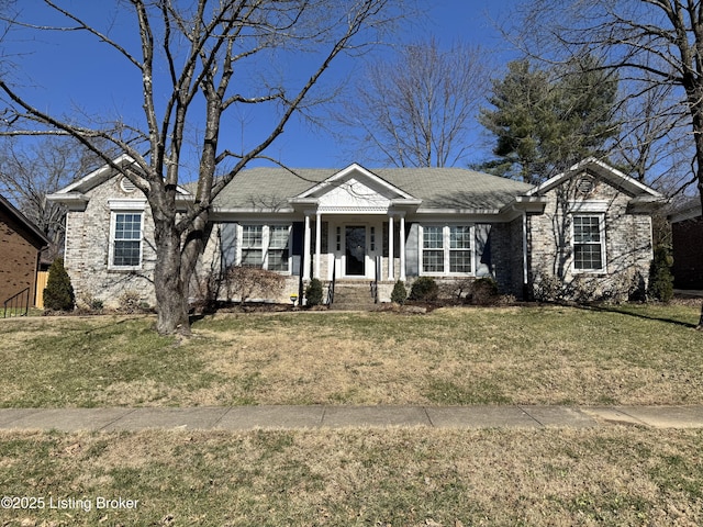 view of front of property featuring a front lawn and brick siding