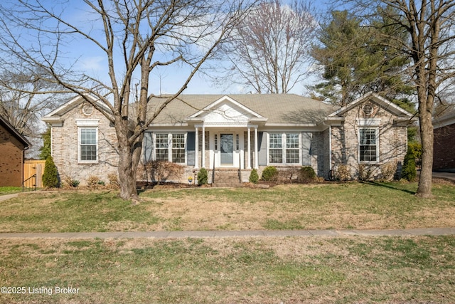 ranch-style home featuring a front lawn