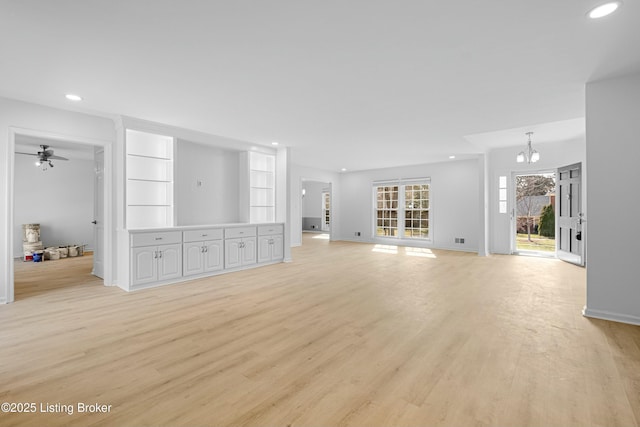 unfurnished living room featuring recessed lighting, visible vents, baseboards, and light wood-style floors