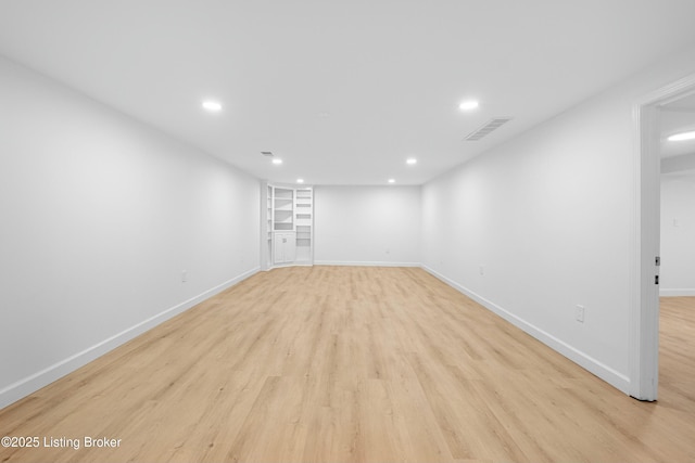 interior space with baseboards, recessed lighting, visible vents, and light wood-type flooring