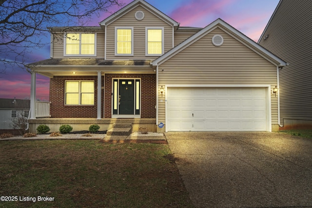 traditional-style home with brick siding, a porch, concrete driveway, and an attached garage