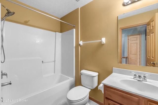 bathroom with toilet, bathtub / shower combination, vanity, and a textured ceiling