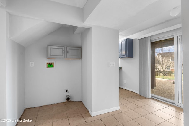 clothes washing area featuring light tile patterned floors, baseboards, and hookup for an electric dryer