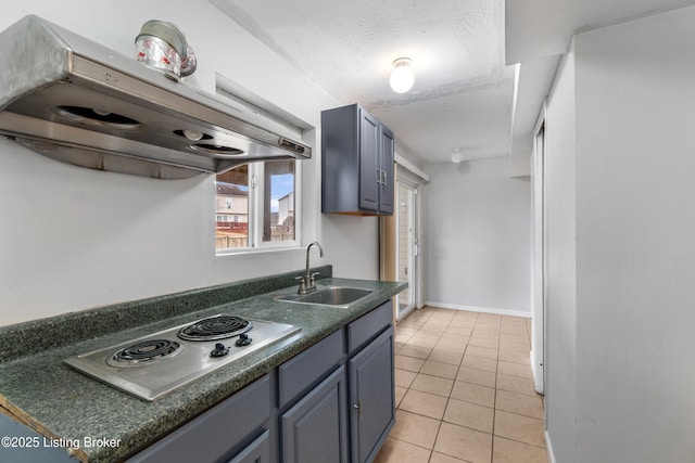 kitchen featuring a sink, stainless steel electric cooktop, dark countertops, exhaust hood, and light tile patterned flooring