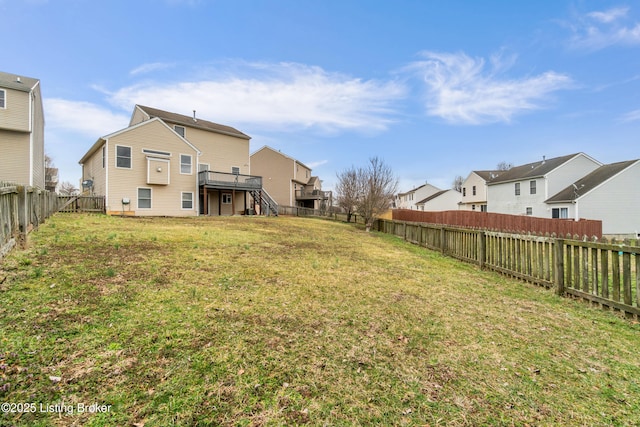 view of yard featuring stairway, a residential view, and a fenced backyard