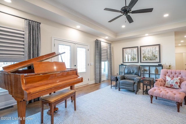 sitting room featuring visible vents, baseboards, ornamental molding, recessed lighting, and wood finished floors