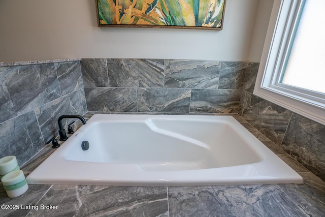 bathroom with a garden tub