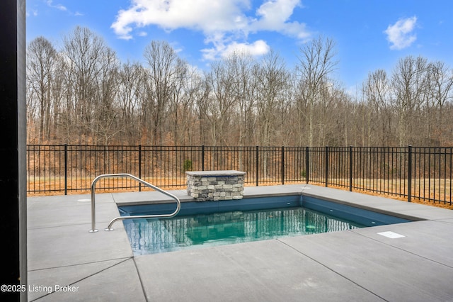 view of swimming pool featuring a patio area, a fenced in pool, and a fenced backyard