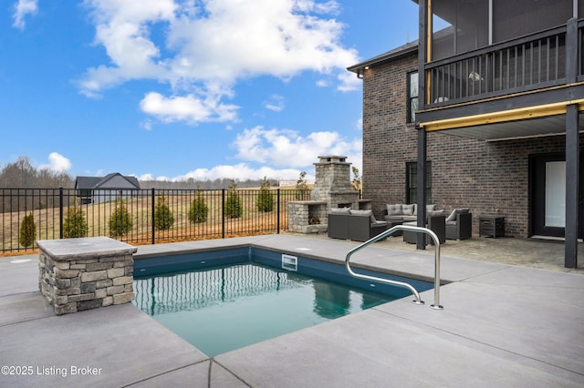 view of swimming pool featuring an outdoor living space with a fireplace, a fenced in pool, a patio, and fence