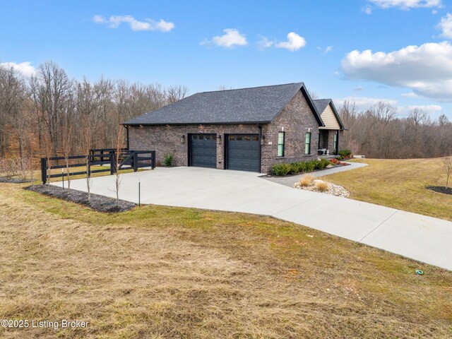 view of home's exterior with fence, roof with shingles, an attached garage, a yard, and brick siding