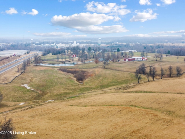 birds eye view of property featuring a rural view