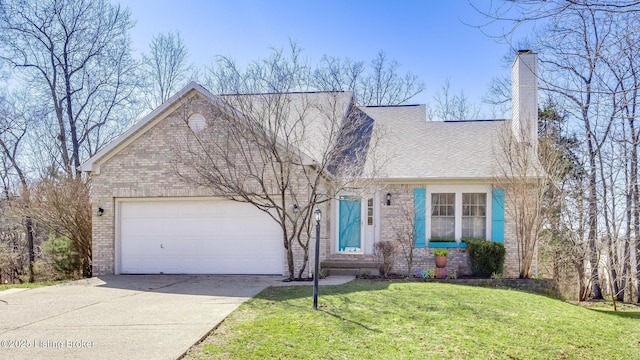 view of front of house with concrete driveway, an attached garage, a front yard, brick siding, and a chimney