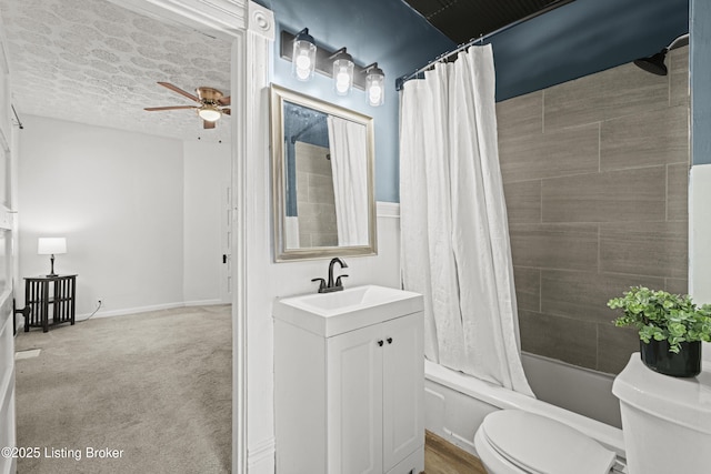 bathroom featuring vanity, a ceiling fan, shower / tub combo, a textured ceiling, and toilet