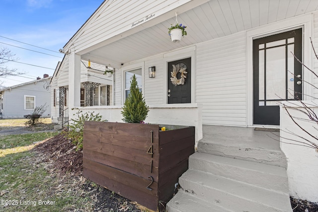 property entrance featuring covered porch