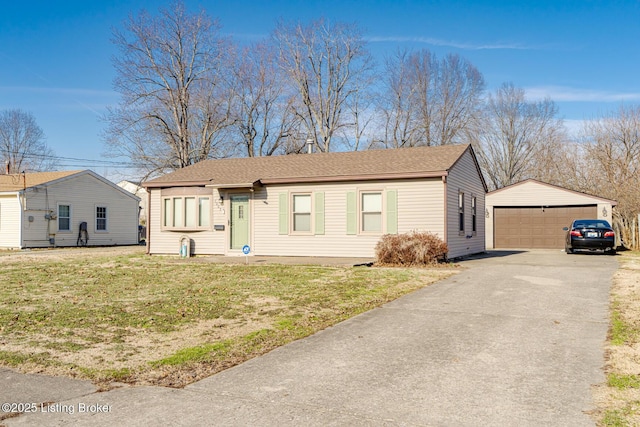 single story home with a garage, a front lawn, an outdoor structure, and a shingled roof