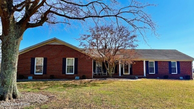 115 Poplar Ave, Magnolia, KY 42757 - ranch-style house featuring a front lawn and brick siding
