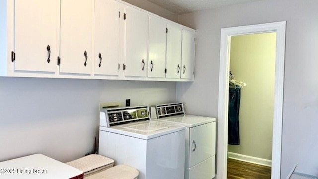 laundry room with baseboards, cabinet space, independent washer and dryer, and wood finished floors