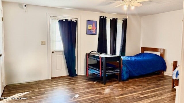 bedroom featuring wood finished floors and a ceiling fan