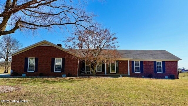 ranch-style house with brick siding and a front lawn