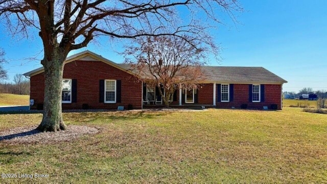 ranch-style home with a front lawn