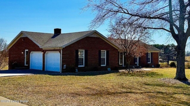 view of front of property with driveway, an attached garage, and a front lawn