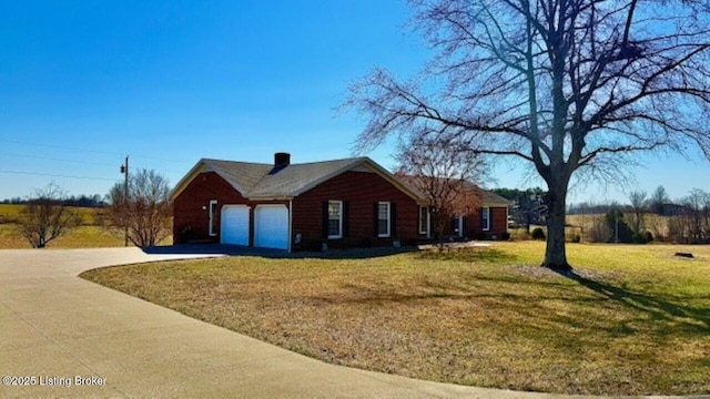 view of side of home featuring concrete driveway, a lawn, and a garage