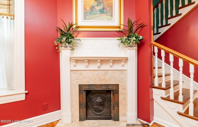 interior space with baseboards and a premium fireplace