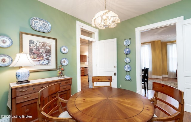 dining space featuring an inviting chandelier