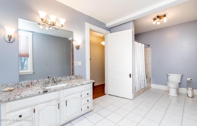 bathroom featuring tile patterned flooring, baseboards, toilet, a shower with shower curtain, and vanity